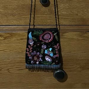 Floral purse. Unused. Has two pockets.